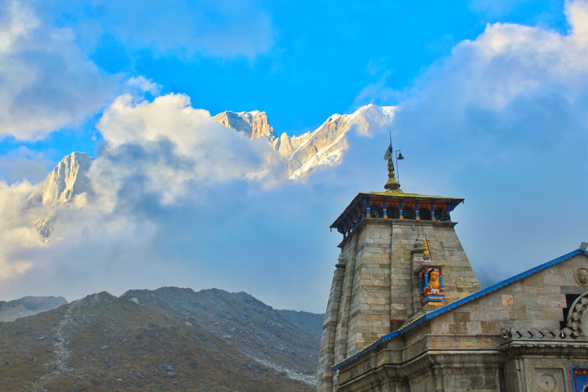 Himalayan mountain valley with temple flags on the Char Dham pilgrimage route in Uttarakhand